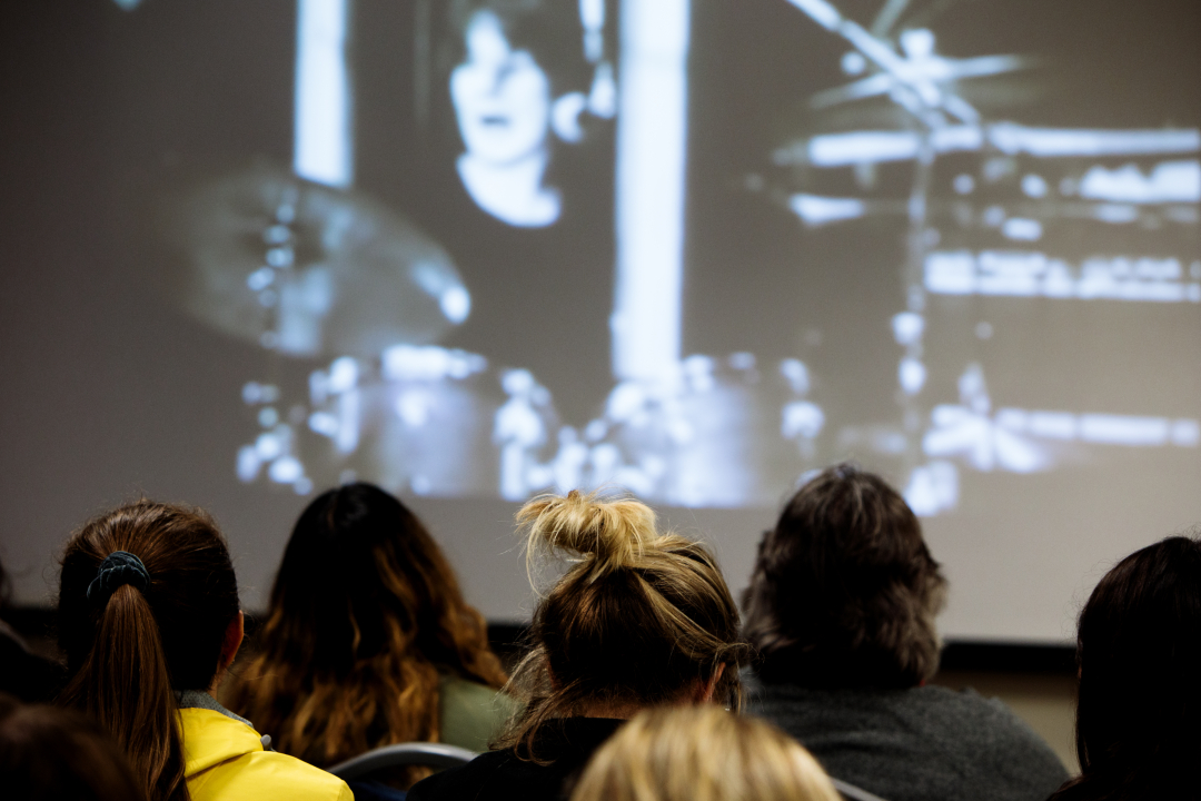 Students looking at screen during a lecture